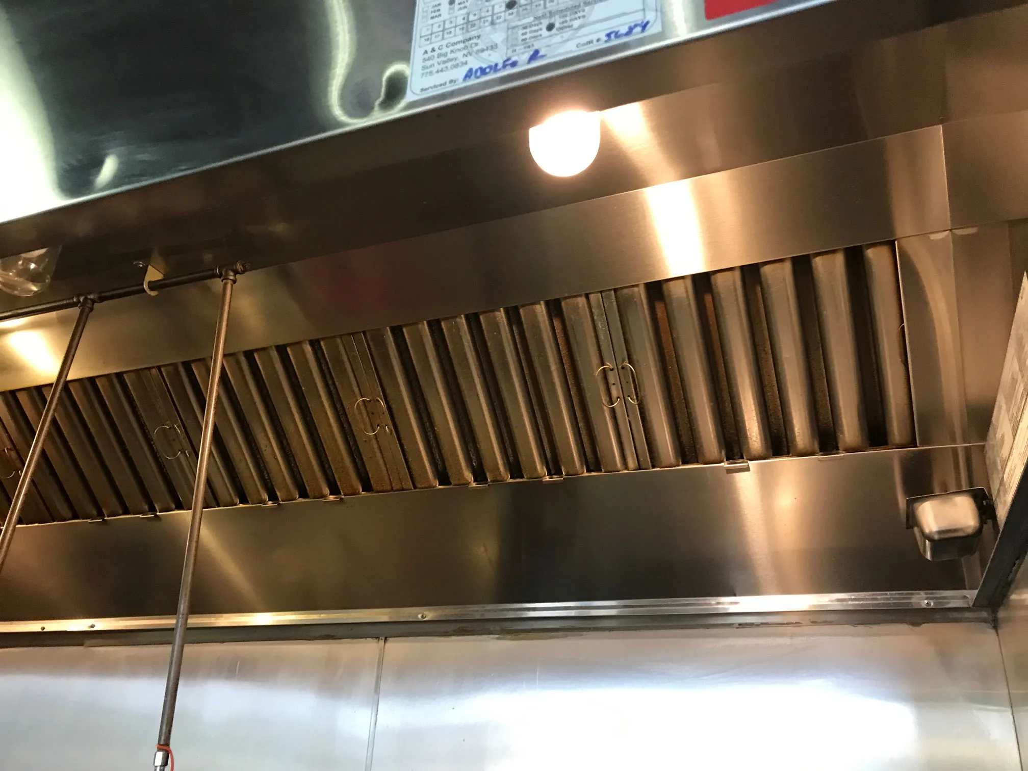 Satisfied restaurant owner with Maine Hood Cleaning professional
